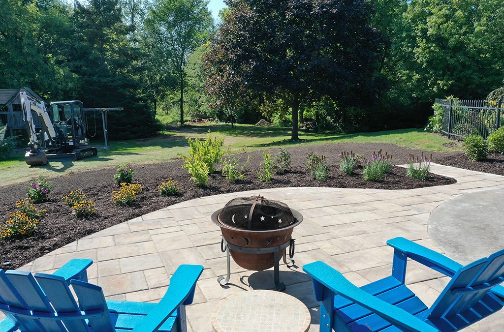 Paver patio with landscaping and firepit